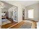 Welcoming foyer showcasing beautiful hardwood floors, a patterned rug, and glass doors opening to a bright office space at 1181 Fairview Ne Rd, Atlanta, GA 30306