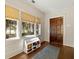 Well-lit foyer with hardwood floors, woven window shades, shoe storage and a front door at 1181 Fairview Ne Rd, Atlanta, GA 30306