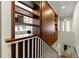 Hallway features built in bookshelf with view into the living area and staircase to the lower level at 1181 Fairview Ne Rd, Atlanta, GA 30306