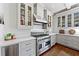 Gourmet kitchen features stainless steel appliances, light gray cabinets, and a gorgeous hardwood floor at 1181 Fairview Ne Rd, Atlanta, GA 30306