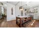 A kitchen with hardwood floors features an island with bar stool seating, light fixtures, and stainless appliances at 1181 Fairview Ne Rd, Atlanta, GA 30306