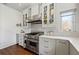 Modern kitchen features stainless steel appliances, light gray cabinets, and a view from the window at 1181 Fairview Ne Rd, Atlanta, GA 30306