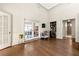 Bright living room featuring high ceilings, hardwood floors, and a built-in bar with beverage center at 1181 Fairview Ne Rd, Atlanta, GA 30306