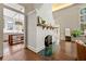 Living room highlighting hardwood floors, fireplace, and views into the kitchen at 1181 Fairview Ne Rd, Atlanta, GA 30306