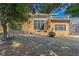 A brick home boasting a flat roof, complemented by a cozy outdoor seating area, and a well-manicured lawn at 1181 Fairview Ne Rd, Atlanta, GA 30306