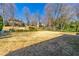 Expansive yard with a view of neighboring homes and mature trees, creating a serene environment at 1181 Fairview Ne Rd, Atlanta, GA 30306