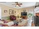 Comfortable living room featuring a fireplace, decorative rug, and cozy seating arrangement at 1274 Creek Laurel Dr, Lawrenceville, GA 30043