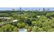 Stunning aerial view of the property showcasing lush greenery and the city skyline in the background at 24308 Plantation Ne Dr, Atlanta, GA 30324