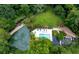 An aerial view showcasing the pool and outdoor amenities surrounded by lush landscaping and mature trees at 24308 Plantation Ne Dr, Atlanta, GA 30324
