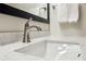 Close-up of a bathroom sink with a marble countertop and modern faucet at 24308 Plantation Ne Dr, Atlanta, GA 30324