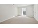 Bright bedroom featuring plush carpeting, neutral walls and natural light at 24308 Plantation Ne Dr, Atlanta, GA 30324