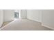 Bright bedroom features neutral carpet, natural light from a window, and fresh paint for a serene atmosphere at 24308 Plantation Ne Dr, Atlanta, GA 30324