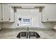 Kitchen view from living room with granite countertops and sink at 24308 Plantation Ne Dr, Atlanta, GA 30324