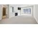 Bright living room with a fireplace, built-in shelving, and ample natural light from large windows at 24308 Plantation Ne Dr, Atlanta, GA 30324