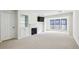 Inviting living area features a fireplace, built-in shelving, and bright natural light at 24308 Plantation Ne Dr, Atlanta, GA 30324