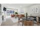 Open-concept living room boasts natural light, a modern fireplace, and stylish furnishings for relaxation at 24308 Plantation Ne Dr, Atlanta, GA 30324