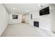 Bright and airy living room featuring fresh white walls, neutral carpet, a fireplace, and recessed lighting at 24308 Plantation Ne Dr, Atlanta, GA 30324