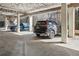 A covered parking area featuring multiple parking spaces, offering protection and convenience for vehicles at 24308 Plantation Ne Dr, Atlanta, GA 30324