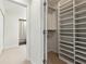 Well-organized walk-in closet with built-in shelving and ample storage space at 24308 Plantation Ne Dr, Atlanta, GA 30324