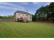Spacious backyard with a deck, perfect for entertaining and outdoor enjoyment at 235 Rippling Nw Dr, Marietta, GA 30064