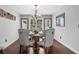 Elegant dining room featuring a round table, upholstered chairs, and a stylish chandelier at 3135 Nectar Dr, Powder Springs, GA 30127