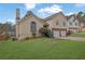 Street view showcasing the home's architectural details, well-kept lawn, and pleasant neighborhood setting at 3135 Nectar Dr, Powder Springs, GA 30127