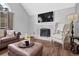 Cozy living room featuring a fireplace, vaulted ceiling, and ample natural light at 3135 Nectar Dr, Powder Springs, GA 30127