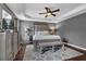 Main bedroom with a ceiling fan, a bed, and white bedding at 3135 Nectar Dr, Powder Springs, GA 30127