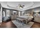 Main bedroom with a ceiling fan, a bed, and white bedding at 3135 Nectar Dr, Powder Springs, GA 30127