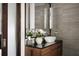 Bathroom vanity featuring natural light, modern sink and wood cabinetry at 437 Hollydale Nw Ct, Atlanta, GA 30342