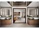 Bathroom view showcases a bedroom, dual vanities, wood cabinets, and modern design at 437 Hollydale Nw Ct, Atlanta, GA 30342