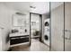 Modern bathroom with a glass shower, sleek vanity, and convenient in-unit laundry at 437 Hollydale Nw Ct, Atlanta, GA 30342