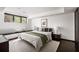 Serene bedroom featuring a window seat, plush bedding, and minimalist design at 437 Hollydale Nw Ct, Atlanta, GA 30342