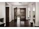 Inviting entryway featuring dark hardwood floors and modern double doors with glass accents at 437 Hollydale Nw Ct, Atlanta, GA 30342