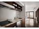 Compact kitchenette with modern appliances, marble countertops, and sleek cabinetry at 437 Hollydale Nw Ct, Atlanta, GA 30342