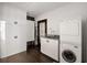 This modern laundry room boasts ample cabinet space and in-unit washer and dryer at 437 Hollydale Nw Ct, Atlanta, GA 30342