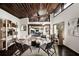 Bright, modern living room with wooden ceiling, sleek shelving, and a view to outdoor patio at 437 Hollydale Nw Ct, Atlanta, GA 30342