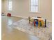 Large bonus room featuring painted concrete floors and a colorful play area at 5322 Seaton Dr, Dunwoody, GA 30338