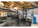 Basement gym with free weights, weight rack, mirror and motivational wall art at 5322 Seaton Dr, Dunwoody, GA 30338