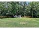 A large backyard offers privacy and includes two convenient storage sheds at 1665 Windsong Park Dr, Dacula, GA 30019