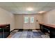 Unfinished basement with unique carpet squares and french doors to outside at 1665 Windsong Park Dr, Dacula, GA 30019