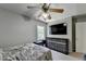 Bedroom with a ceiling fan and a mounted television above a dresser at 1665 Windsong Park Dr, Dacula, GA 30019