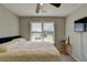 Bedroom featuring a window and a mounted television at 1665 Windsong Park Dr, Dacula, GA 30019