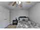 Neutral bedroom with a ceiling fan, a double bed, one nightstand, and closet for storage at 1665 Windsong Park Dr, Dacula, GA 30019