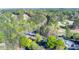 Aerial view of the community featuring the golf course, clubhouse, and bridge at 2001 Towne Lake W Hls, Woodstock, GA 30189