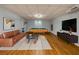 Finished basement offers entertainment area with a pool table and a comfortable seating area at 2001 Towne Lake W Hls, Woodstock, GA 30189