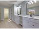 Bathroom features double sink vanity and a walk-in closet at 2001 Towne Lake W Hls, Woodstock, GA 30189