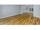 Spacious dining room featuring hardwood floors, wainscoting, and a modern light fixture at 2001 Towne Lake W Hls, Woodstock, GA 30189