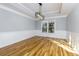 Elegant dining room with hardwood floors, wainscoting, and modern lighting at 2001 Towne Lake W Hls, Woodstock, GA 30189