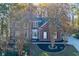 Beautiful two-story brick home featuring a well-manicured front lawn and driveway at 2001 Towne Lake W Hls, Woodstock, GA 30189